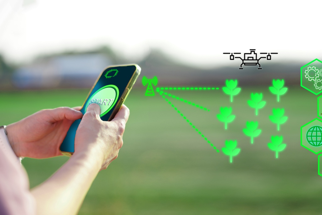 A close-up of a person holding a smartphone with a green icon that says "Smart" and other abstract green graphics in the air beside it.